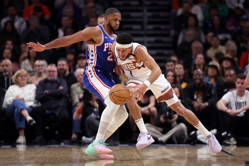 PHOENIX, ARIZONA - NOVEMBER 04: Devin Booker #1 of the Phoenix Suns drives against Eric Gordon #23 of the Philadelphia 76ers during the first half at Footprint Center on November 04, 2024 in Phoenix, Arizona. NOTE TO USER: User expressly acknowledges and agrees that, by downloading and or using this photograph, User is consenting to the terms and conditions of the Getty Images License Agreement.  (Photo by Chris Coduto/Getty Images)