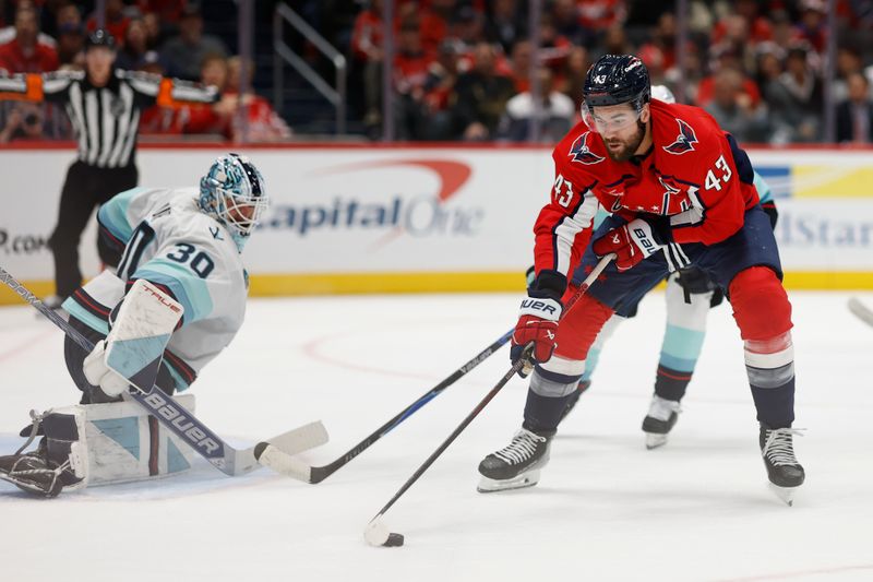 Oct 21, 2025; Washington, District of Columbia, USA; Washington Capitals right wing Tom Wilson (43) skates with the puck against on Seattle Kraken goaltender Matt Murray (30) as Kraken defenseman Ryan Lindgren (55) defend sduring the third period at Capital One Arena. Mandatory Credit: Geoff Burke-Imagn Images