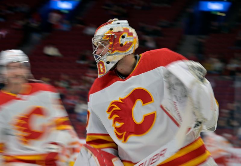 Nov 14, 2023; Montreal, Quebec, CAN; Calgary Flames goalie Dan Vladar (80) skates during the warm up period before the game against the Montreal Canadiens at the Bell Centre. Mandatory Credit: Eric Bolte-USA TODAY Sports