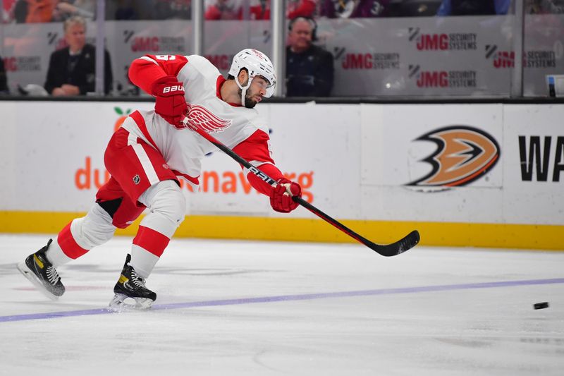 Jan 7, 2024; Anaheim, California, USA; Detroit Red Wings defenseman Jake Walman (96) shoots on goal against the Anaheim Ducks during the first period at Honda Center. Mandatory Credit: Gary A. Vasquez-USA TODAY Sports