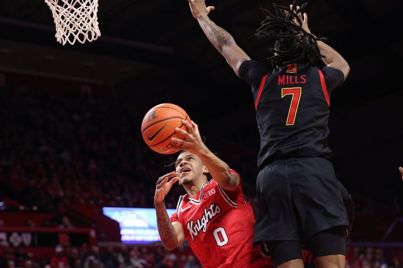 Feb 15, 2026; Piscataway, New Jersey, USA; Rutgers Scarlet Knights guard Tariq Francis (0) goes to the basket against Maryland Terrapins guard Andre Mills (7) during the second half at Jersey Mike's Arena. Mandatory Credit: Vincent Carchietta-Imagn Images