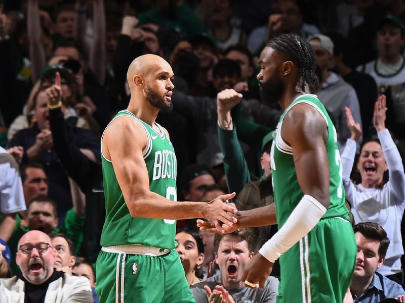 BOSTON, MA - APRIL 24: Derrick White #9 of the Boston Celtics & Jaylen Brown #7 of the Boston Celtics high five during the game against the Miami Heat  during Round 1 Game 2 of the 2024 NBA Playoffs on April 24, 2024 at the TD Garden in Boston, Massachusetts. NOTE TO USER: User expressly acknowledges and agrees that, by downloading and or using this photograph, User is consenting to the terms and conditions of the Getty Images License Agreement. Mandatory Copyright Notice: Copyright 2024 NBAE  (Photo by Brian Babineau/NBAE via Getty Images)