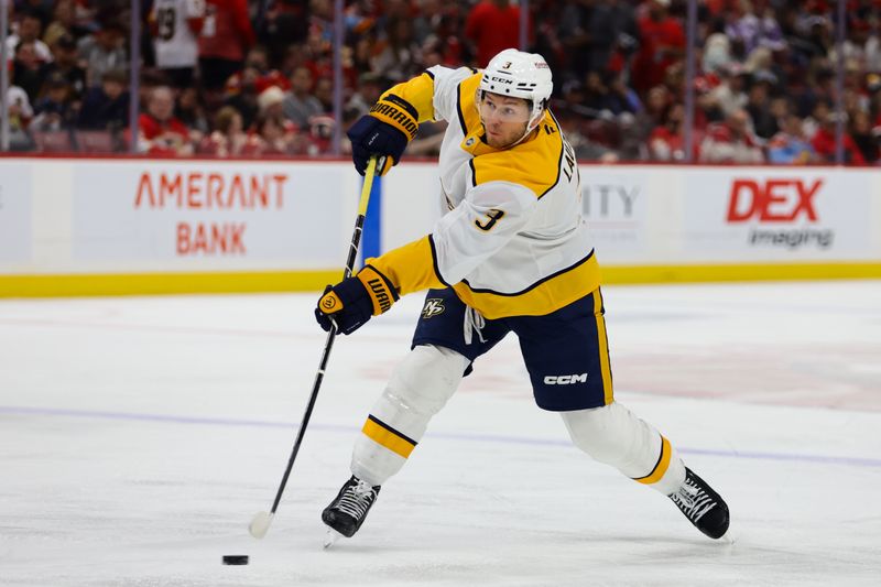 Nov 7, 2024; Sunrise, Florida, USA; Nashville Predators defenseman Jeremy Lauzon (3) shoots the puck against the Florida Panthers during the first period at Amerant Bank Arena. Mandatory Credit: Sam Navarro-Imagn Images