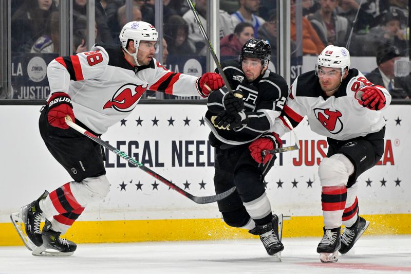 Mar 3, 2024; Los Angeles, California, USA; New Jersey Devils defenseman Kevin Bahl (88), Los Angeles Kings left wing Kevin Fiala (22) and New Jersey Devils right wing Timo Meier (28) race to the puck in the second period at Crypto.com Arena. Mandatory Credit: Jayne Kamin-Oncea-USA TODAY Sports