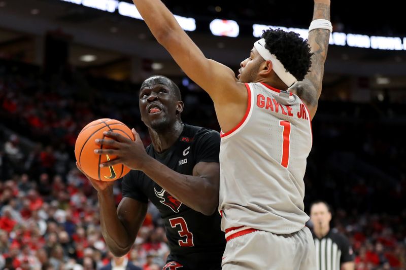 Jan 3, 2024; Columbus, Ohio, USA; Rutgers Scarlet Knights forward Mawot Mag (3) looks for the shot as Ohio State Buckeyes guard Roddy Gayle Jr. (1) defends during the first half at Value City Arena. Mandatory Credit: Joseph Maiorana-USA TODAY Sports