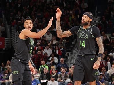 NEW ORLEANS, LA - DECEMBER 19: CJ McCollum #3 of the New Orleans Pelicans high fives Brandon Ingram #14 of the New Orleans Pelicans during the game against the Memphis Grizzlies on December 19, 2023 at the Smoothie King Center in New Orleans, Louisiana. NOTE TO USER: User expressly acknowledges and agrees that, by downloading and or using this Photograph, user is consenting to the terms and conditions of the Getty Images License Agreement. Mandatory Copyright Notice: Copyright 2023 NBAE (Photo by Jonathan Bachman/NBAE via Getty Images)