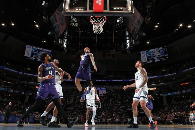 MEMPHIS, TN - MARCH 13: Miles Bridges #0 of the Charlotte Hornets dunks the ball during the game against the Memphis Grizzlies on March 13, 2024 at FedExForum in Memphis, Tennessee. NOTE TO USER: User expressly acknowledges and agrees that, by downloading and or using this photograph, User is consenting to the terms and conditions of the Getty Images License Agreement. Mandatory Copyright Notice: Copyright 2024 NBAE (Photo by Joe Murphy/NBAE via Getty Images)