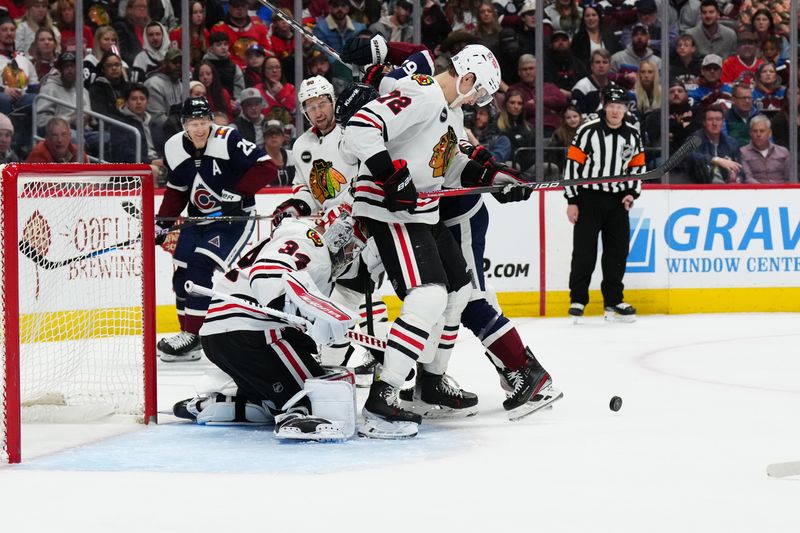 Mar 4, 2024; Denver, Colorado, USA; Chicago Blackhawks goaltender Petr Mrazek (34) and defenseman Alex Vlasic (72) defend on Colorado Avalanche left wing Artturi Lehkonen (62) in the second period at Ball Arena. Mandatory Credit: Ron Chenoy-USA TODAY Sports