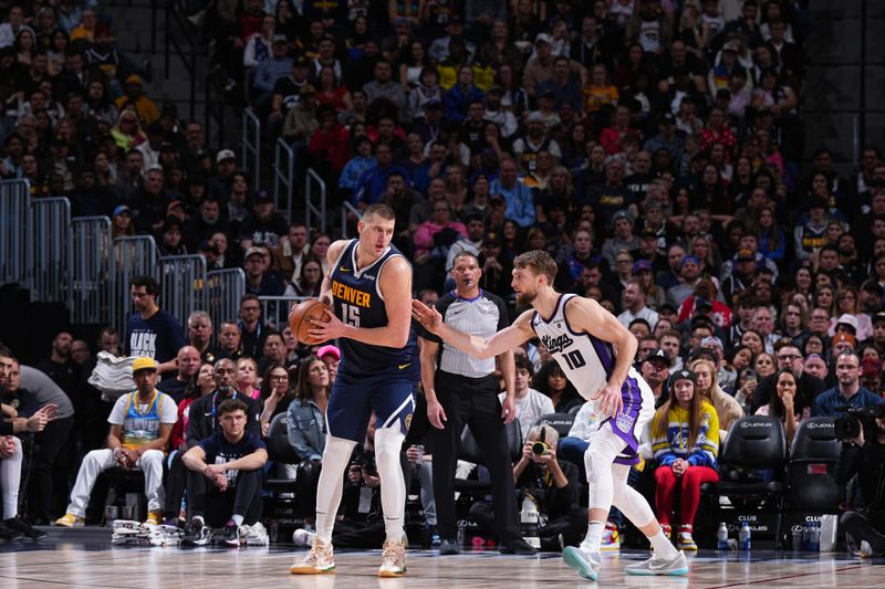 DENVER, CO - FEBRUARY 14: Nikola Jokic #15 of the Denver Nuggets looks to pass the ball during the game against the Sacramento Kings on February 14, 2024 at the Ball Arena in Denver, Colorado. NOTE TO USER: User expressly acknowledges and agrees that, by downloading and/or using this Photograph, user is consenting to the terms and conditions of the Getty Images License Agreement. Mandatory Copyright Notice: Copyright 2024 NBAE (Photo by Garrett Ellwood/NBAE via Getty Images)