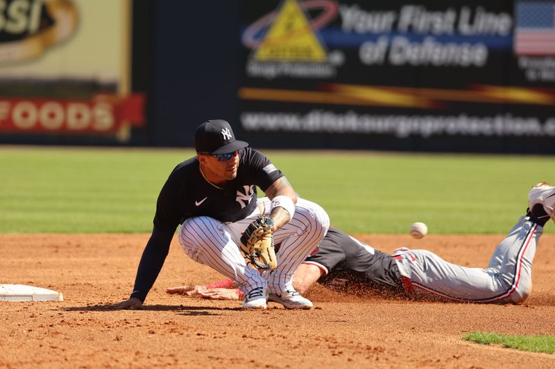 Feb 26, 2024; Tampa, Florida, USA; Minnesota Twins second baseman Edouard Julien (47) steals second base as New York Yankees second baseman Gleyber Torres (25) attempted to tag him out at George M. Steinbrenner Field. Mandatory Credit: Kim Klement Neitzel-USA TODAY Sports