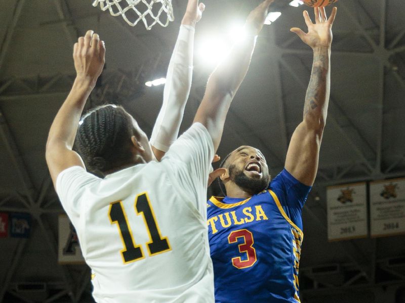 Jan 14, 2023; Wichita, Kansas, USA; Tulsa Golden Hurricane guard Sterling Gaston-Chapman (3) puts up a shot over Wichita State Shockers forward Kenny Pohto (11) during the first half at Charles Koch Arena. Mandatory Credit: William Purnell-USA TODAY Sports