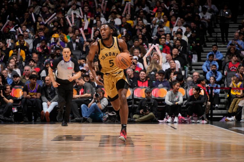 TORONTO, CANADA - APRIL 2: Immanuel Quickley #5 of the Toronto Raptors dribbles the ball during the game against the Los Angeles Lakers on April 2, 2024 at the Scotiabank Arena in Toronto, Ontario, Canada.  NOTE TO USER: User expressly acknowledges and agrees that, by downloading and or using this Photograph, user is consenting to the terms and conditions of the Getty Images License Agreement.  Mandatory Copyright Notice: Copyright 2024 NBAE (Photo by Mark Blinch/NBAE via Getty Images)