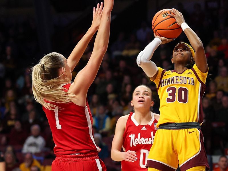 Jan 14, 2024; Minneapolis, Minnesota, USA; Minnesota Golden Gophers guard Janay Sanders (30) shoots as Nebraska Cornhuskers guard Jaz Shelley (1) defends during the first half at Williams Arena. Mandatory Credit: Matt Krohn-USA TODAY Sports