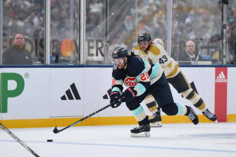 Jan 1, 2024; Seattle, Washington, USA; Seattle Kraken right wing Oliver Bjorkstrand (22) advances the puck against the Vegas Golden Knights during the second period in the 2024 Winter Classic ice hockey game at T-Mobile Park. Mandatory Credit: Steven Bisig-USA TODAY Sports