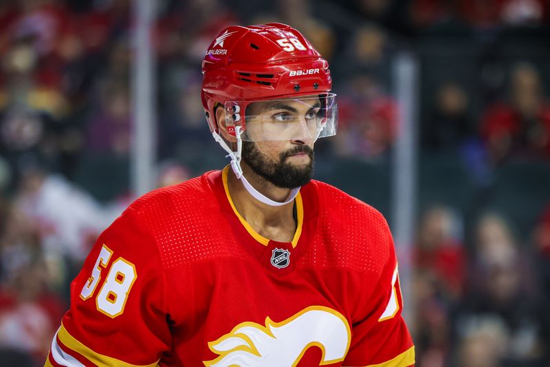 Feb 22, 2024; Calgary, Alberta, CAN; Calgary Flames defenseman Oliver Kylington (58) against the Boston Bruins during the first period at Scotiabank Saddledome. Mandatory Credit: Sergei Belski-USA TODAY Sports