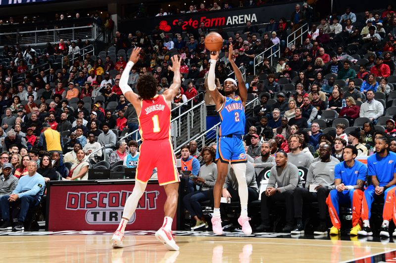 ATLANTA, GA - JANUARY 3: Shai Gilgeous-Alexander #2 of the Oklahoma City Thunder shoots a three point basket after the game against the Atlanta Hawks on January 3, 2024 at State Farm Arena in Atlanta, Georgia.  NOTE TO USER: User expressly acknowledges and agrees that, by downloading and/or using this Photograph, user is consenting to the terms and conditions of the Getty Images License Agreement. Mandatory Copyright Notice: Copyright 2024 NBAE (Photo by Scott Cunningham/NBAE via Getty Images)