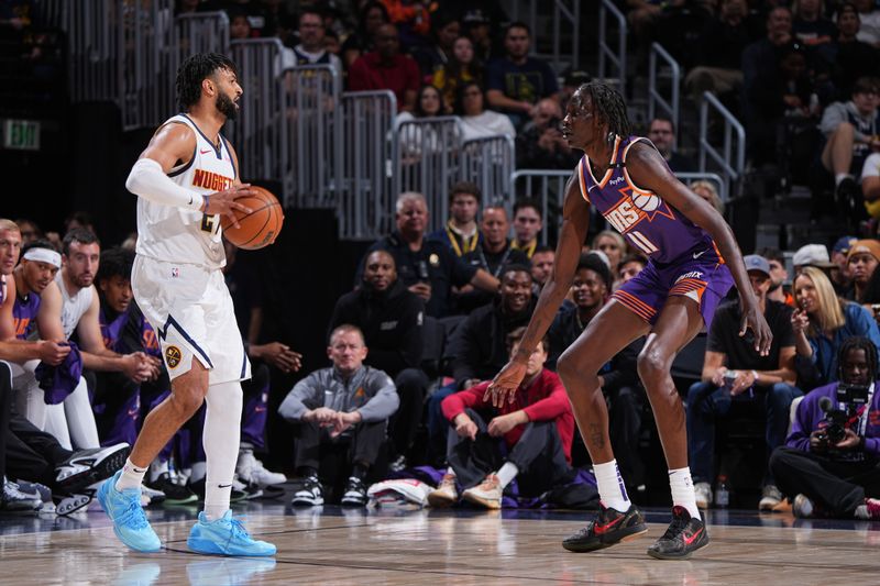 DENVER, CO - OCTOBER 13: Jamal Murray #27 of the Denver Nuggets handles the ball during the game against the Phoenix Suns on October 13, 2024 at Ball Arena in Denver, Colorado. NOTE TO USER: User expressly acknowledges and agrees that, by downloading and/or using this Photograph, user is consenting to the terms and conditions of the Getty Images License Agreement. Mandatory Copyright Notice: Copyright 2024 NBAE (Photo by Garrett Ellwood/NBAE via Getty Images)