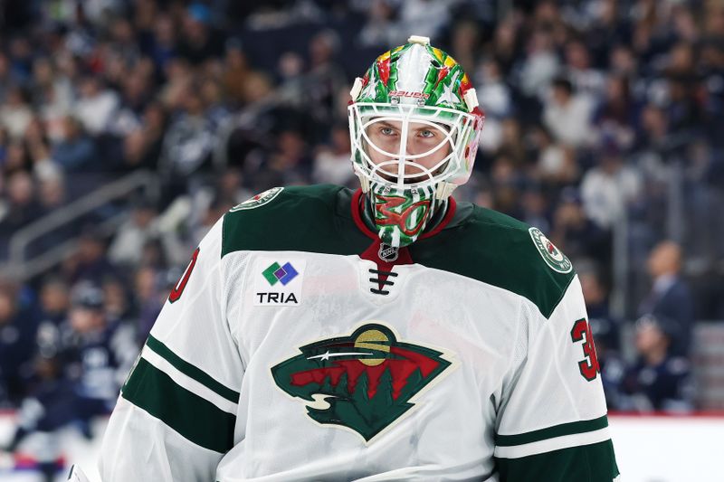 Sep 21, 2025; Winnipeg, Manitoba, CAN; Minnesota Wild goaltender Jesper Wallstedt (30) looks on during a break in play during the second period against the Winnipeg Jets at Canada Life Centre. Mandatory Credit: James Carey Lauder-Imagn Images
