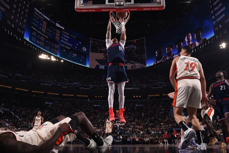 INGLEWOOD, CA - MARCH 5: Jordan Miller #11 of the LA Clippers dunks the ball during the game against the Detroit Pistons on March 5, 2025 at Intuit Dome in Los Angeles, California. NOTE TO USER: User expressly acknowledges and agrees that, by downloading and/or using this Photograph, user is consenting to the terms and conditions of the Getty Images License Agreement. Mandatory Copyright Notice: Copyright 2025 NBAE (Photo by Juan Ocampo/NBAE via Getty Images)