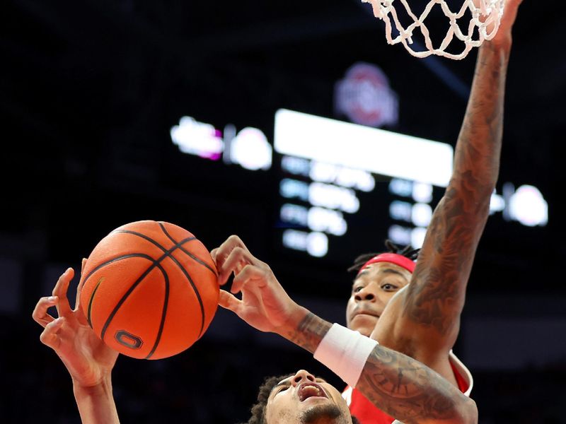 Feb 8, 2026; Columbus, Ohio, USA;  Michigan Wolverines forward Yaxel Lendeborg (23) drives to the basket as Ohio State Buckeyes forward Amare Bynum (1) defends during the first half at Value City Arena. Mandatory Credit: Joseph Maiorana-Imagn Images
