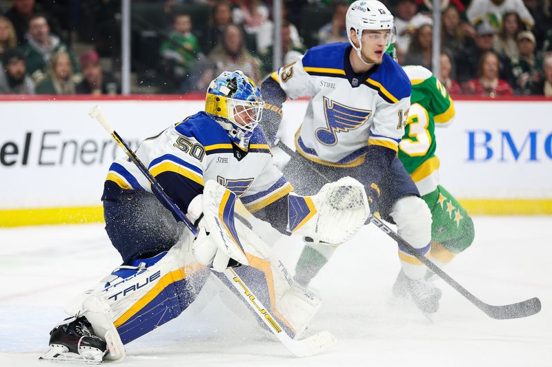 Mar 23, 2024; Saint Paul, Minnesota, USA; St. Louis Blues goaltender Jordan Binnington (50) defends his net against the Minnesota Wild during the first period at Xcel Energy Center. Mandatory Credit: Matt Krohn-USA TODAY Sports