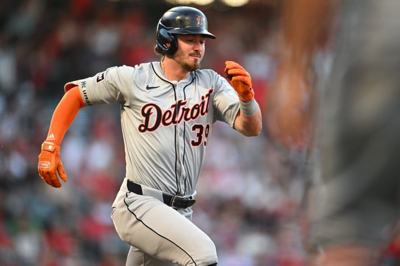 Jun 29, 2024; Anaheim, California, USA; Detroit Tigers shortstop Zach McKinstry (39) runs to first base against the Los Angeles Angels during the second inning at Angel Stadium. Mandatory Credit: Jonathan Hui-USA TODAY Sports