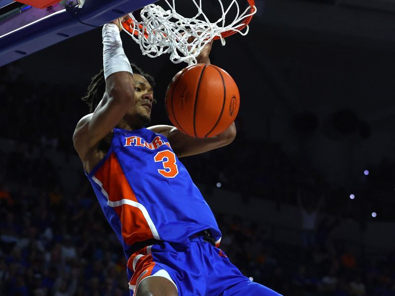 Feb 1, 2023; Gainesville, Florida, USA; Florida Gators forward Alex Fudge (3) dunks against the Tennessee Volunteers during the first half at Exactech Arena at the Stephen C. O'Connell Center. Mandatory Credit: Kim Klement-USA TODAY Sports