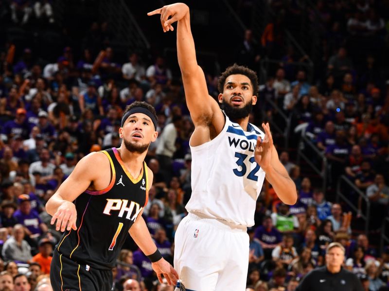 PHOENIX, AZ - APRIL 4: Karl-Anthony Towns #32 of the Minnesota Timberwolves looks on during the game against the Phoenix Suns during Round 1 Game 4 of the 2024 NBA Playoffs on April 4, 2023 at Footprint Center in Phoenix, Arizona. NOTE TO USER: User expressly acknowledges and agrees that, by downloading and or using this photograph, user is consenting to the terms and conditions of the Getty Images License Agreement. Mandatory Copyright Notice: Copyright 2024 NBAE (Photo by Barry Gossage/NBAE via Getty Images)