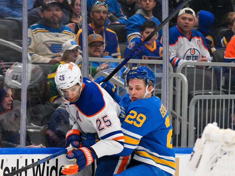 Mar 13, 2026; St. Louis, Missouri, USA; Edmonton Oilers defenseman Darnell Nurse (25) is checked by St. Louis Blues right wing Jonatan Berggren (29) during the second period at Enterprise Center. Mandatory Credit: Jeff Curry-Imagn Images