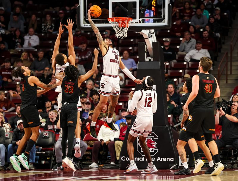 Dec 19, 2023; Columbia, South Carolina, USA; South Carolina Gamecocks guard Myles Stute (10) attempts a dunk against the Winthrop Eagles in the second half at Colonial Life Arena. Mandatory Credit: Jeff Blake-USA TODAY Sports