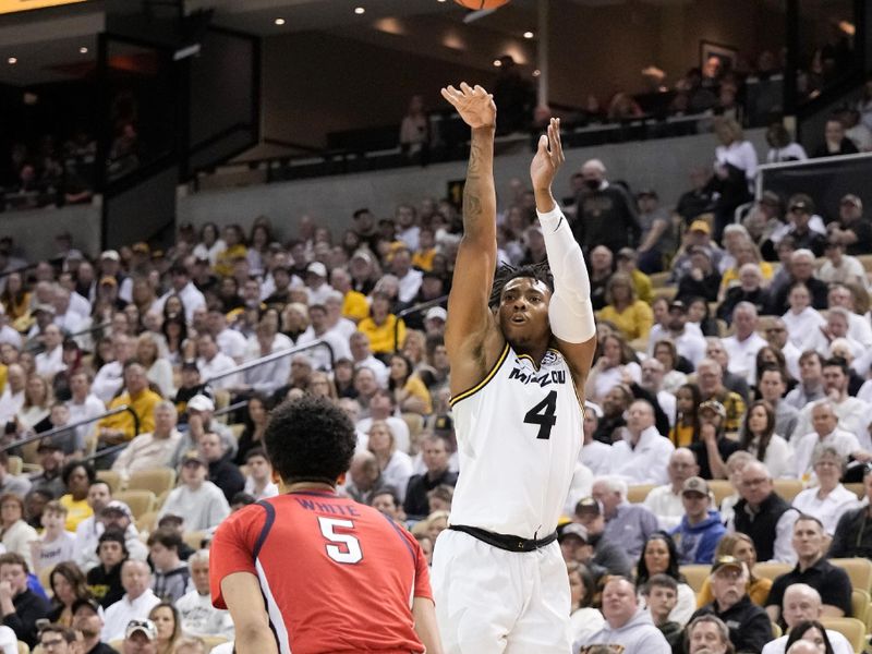 Mar 4, 2023; Columbia, Missouri, USA; Missouri Tigers guard DeAndre Gholston (4) shoots over Mississippi Rebels guard James White (5) during the first half at Mizzou Arena. Mandatory Credit: Denny Medley-USA TODAY Sports