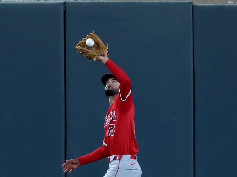 May 19, 2025; West Sacramento, California, USA; Los Angeles Angels center fielder Matthew Lugo (15) catches a fly ball against the Athletics during the eighth inning at Sutter Health Park. Mandatory Credit: Dennis Lee-Imagn Images