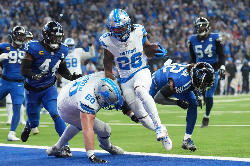 Detroit Lions running back Jahmyr Gibbs (26) rushes for a 1-yard touchdown during the first half of an NFL football game against the Indianapolis Colts, Sunday, Nov. 24, 2024, in Indianapolis. (AP Photo/AJ Mast)