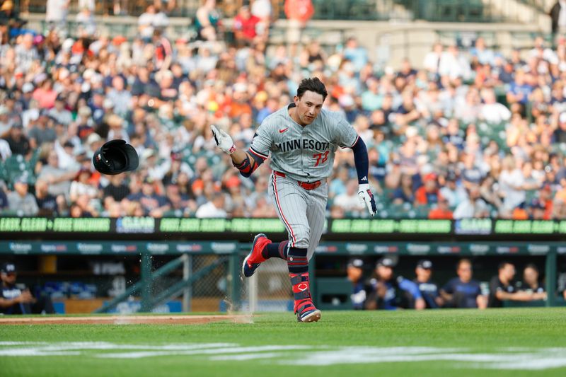 Jul 26, 2024; Detroit, Michigan, USA; Minnesota Twins third baseman Brooks Lee (72) throws his helmet while running to first base after hitting a single during the second inning of the game against the Detroit Tigers at Comerica Park. Mandatory Credit: Brian Bradshaw Sevald-USA TODAY Sports