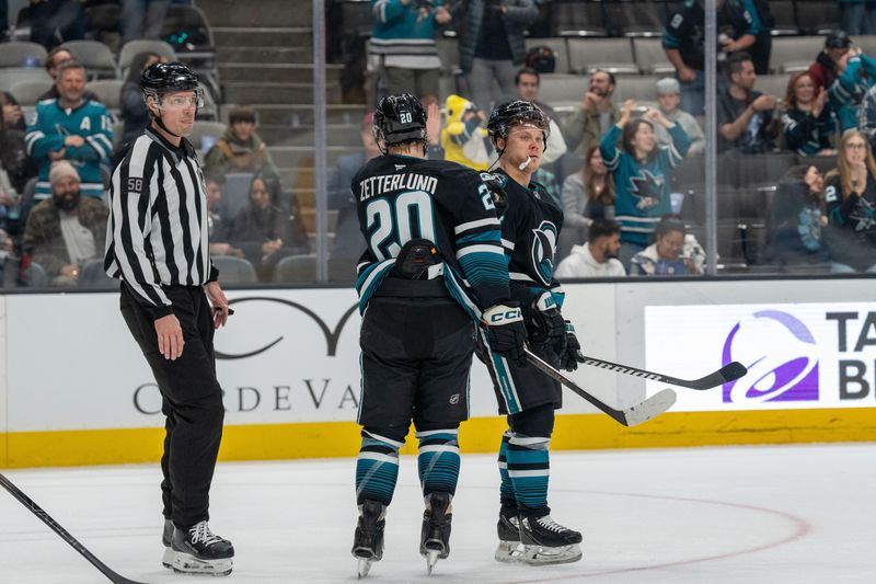 Jan 23, 2025; San Jose, California, USA;  San Jose Sharks left wing Fabian Zetterlund (20) and center Luke Kunin (11) celebrate after the goal during the second period against the Nashville Predators at SAP Center at San Jose. Mandatory Credit: Neville E. Guard-Imagn Images