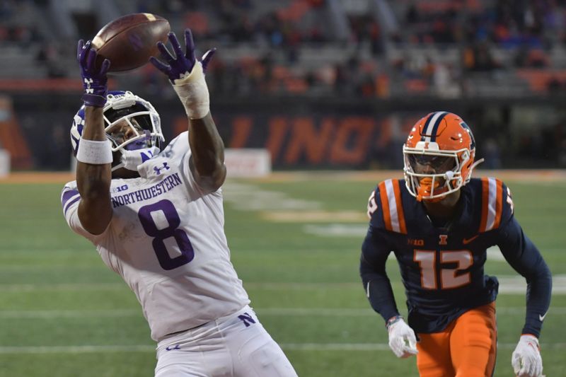 Nov 25, 2023; Champaign, Illinois, USA; Northwestern Wildcats wide receiver A.J. Henning (8) catches a touchdown pass from quarterback Ben Bryant (2) in front of Illinois Fighting Illini defensive back Elijah Mc-Cantos (12) during the second half at Memorial Stadium. Mandatory Credit: Ron Johnson-USA TODAY Sports