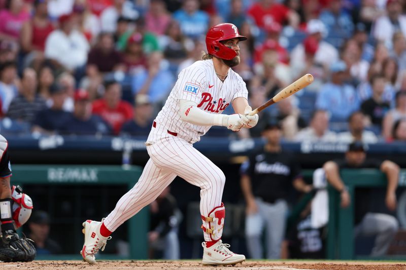 Aug 14, 2024; Philadelphia, Pennsylvania, USA; Philadelphia Phillies first base Bryce Harper (3) hits a double during the first inning against the Miami Marlins at Citizens Bank Park. Mandatory Credit: Bill Streicher-USA TODAY Sports