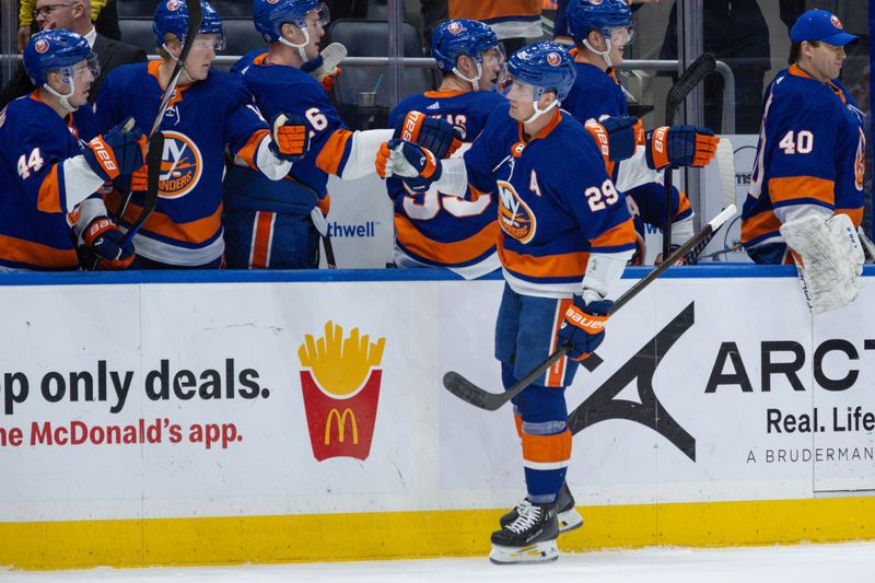 Dec 11, 2023; Elmont, New York, USA; New York Islanders center Brock Nelson (29) celebrates his goal against the Toronto Maple Leafs during the first period at UBS Arena. Mandatory Credit: Thomas Salus-USA TODAY Sports