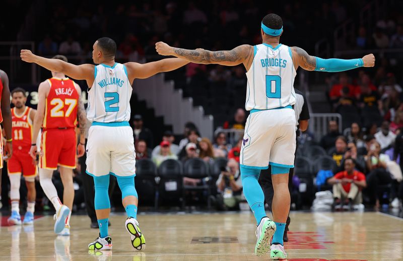 ATLANTA, GEORGIA - APRIL 10:  Grant Williams #2 and Miles Bridges #0 of the Charlotte Hornets react to the officials on a call against the Atlanta Hawks during the first quarter at State Farm Arena on April 10, 2024 in Atlanta, Georgia.  NOTE TO USER: User expressly acknowledges and agrees that, by downloading and/or using this photograph, user is consenting to the terms and conditions of the Getty Images License Agreement.  (Photo by Kevin C. Cox/Getty Images)