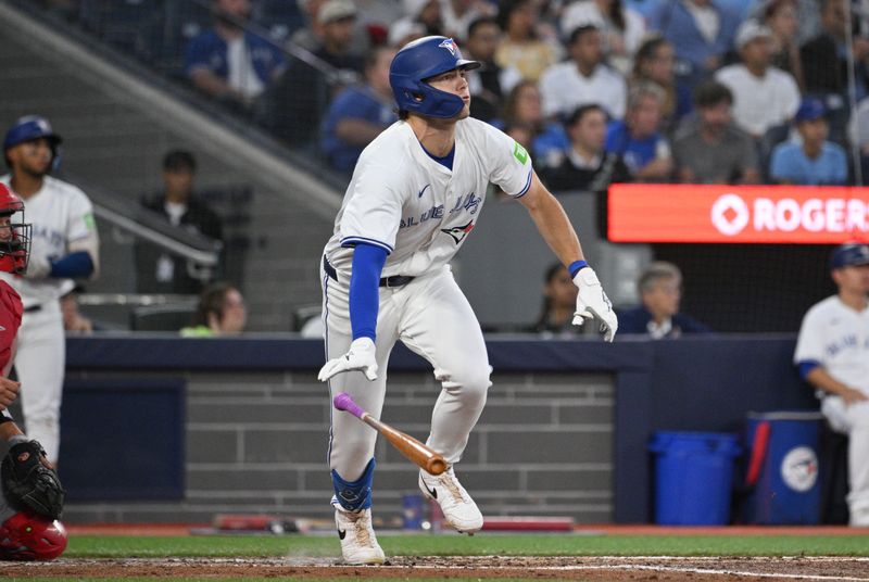 Aug 22, 2024; Toronto, Ontario, CAN;  Toronto Blue Jays left fielder Joey Loperfido (9) hits a triple against the Los Angeles Angels in the second inning at Rogers Centre. Mandatory Credit: Dan Hamilton-USA TODAY Sports