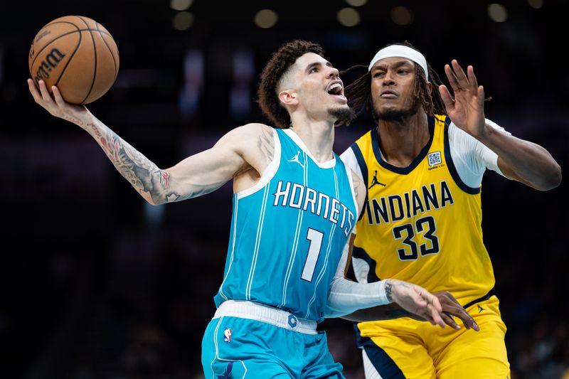 CHARLOTTE, NORTH CAROLINA - NOVEMBER 08: LaMelo Ball #1 of the Charlotte Hornets drives to the basket while guarded by Myles Turner #33 of the Indiana Pacers in the third quarter during their game at Spectrum Center on November 08, 2024 in Charlotte, North Carolina. NOTE TO USER: User expressly acknowledges and agrees that, by downloading and or using this photograph, User is consenting to the terms and conditions of the Getty Images License Agreement. (Photo by Jacob Kupferman/Getty Images)