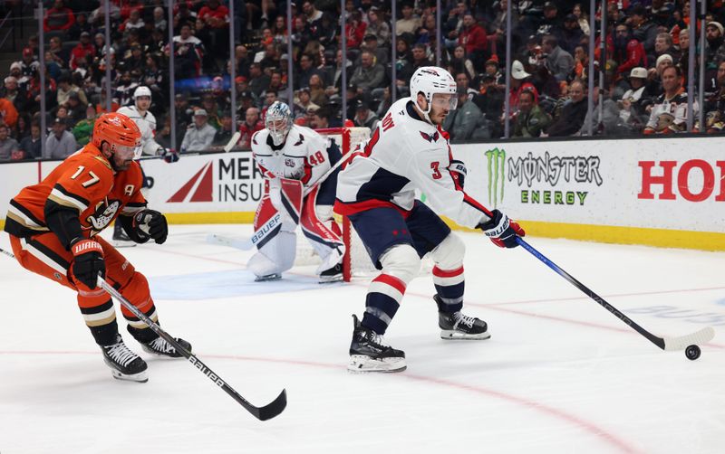 Mar 11, 2025; Anaheim, California, USA; Washington Capitals defenseman Matt Roy (3) passes against Anaheim Ducks left wing Alex Killorn (17) during the second period at Honda Center. Mandatory Credit: Jason Parkhurst-Imagn Images