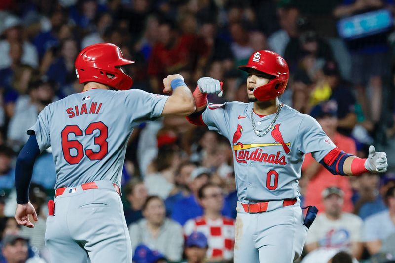 Aug 1, 2024; Chicago, Illinois, USA; St. Louis Cardinals shortstop Masyn Winn (0) celebrates with outfielder Michael Siani (63) after hitting a two-run home run against the Chicago Cubs during the seventh inning at Wrigley Field. Mandatory Credit: Kamil Krzaczynski-USA TODAY Sports