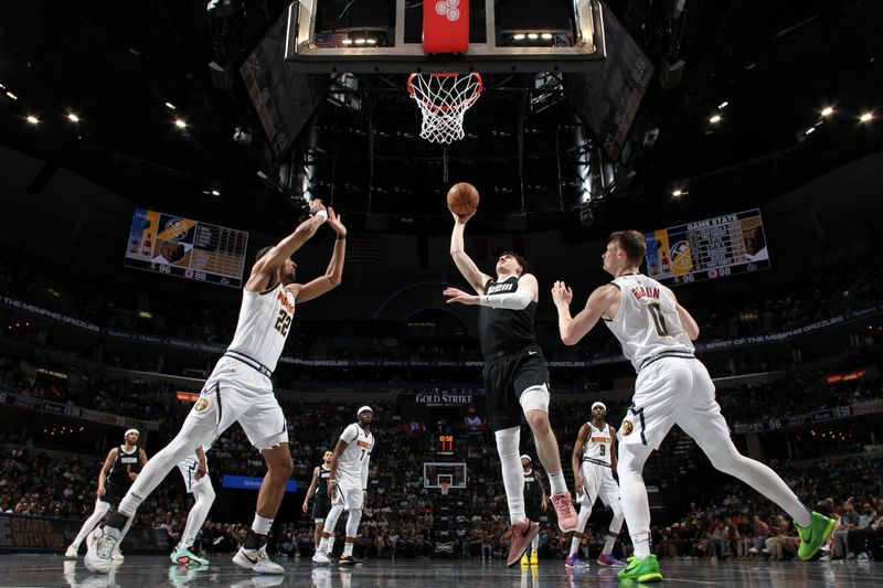 MEMPHIS, TN - APRIL 14:  Jake LaRavia #3 of the Memphis Grizzlies drives to the basket during the game against the Denver Nuggets on April 14, 2024 at FedExForum in Memphis, Tennessee. NOTE TO USER: User expressly acknowledges and agrees that, by downloading and or using this photograph, User is consenting to the terms and conditions of the Getty Images License Agreement. Mandatory Copyright Notice: Copyright 2024 NBAE (Photo by Joe Murphy/NBAE via Getty Images)