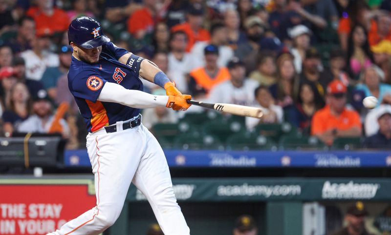 Sep 10, 2023; Houston, Texas, USA; Houston Astros catcher Yainer Diaz (21) hits a single during the sixth inning against the San Diego Padres at Minute Maid Park. Mandatory Credit: Troy Taormina-USA TODAY Sports