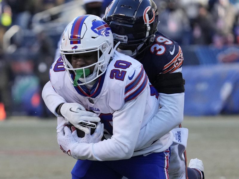 Buffalo Bills running back Nyheim Hines (20) is tackled Chicago Bears cornerback Josh Blackwell during the second half of an NFL football game, Saturday, Dec. 24, 2022, in Chicago. The Bills won 35-13. (AP Photo/Nam Y. Huh)