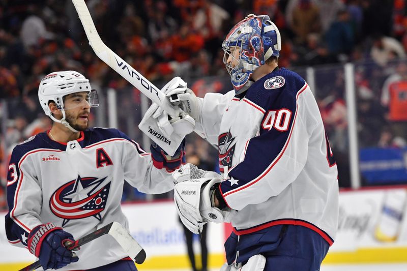 Jan 4, 2024; Philadelphia, Pennsylvania, USA;  Columbus Blue Jackets left wing Johnny Gaudreau (13) and  goaltender Daniil Tarasov (40) celebrate shootout win against the Philadelphia Flyers  at Wells Fargo Center. Mandatory Credit: Eric Hartline-USA TODAY Sports