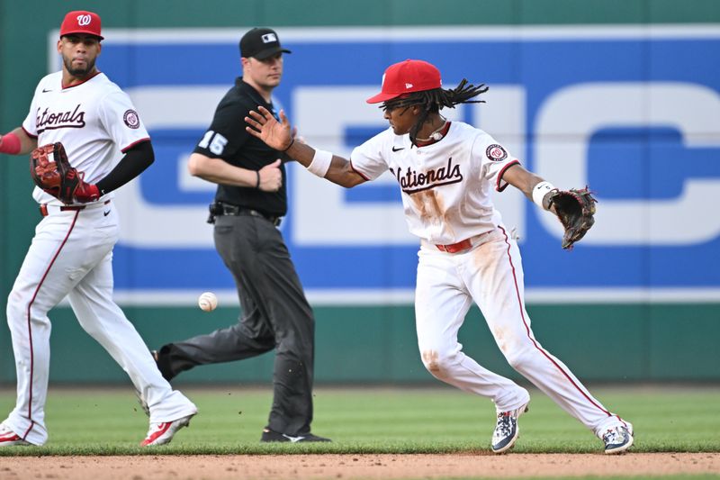 Jul 8, 2024; Washington, District of Columbia, USA; Washington Nationals shortstop CJ Abrams (5) drops the ball in the infield against the St. Louis Cardinals during the eighth inning at Nationals Park. Mandatory Credit: Rafael Suanes-USA TODAY Sports