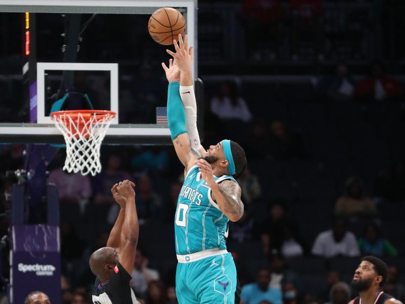 CHARLOTTE, NC - MARCH 31: Miles Bridges #0 of the Charlotte Hornets and Ivica Zubac #40 of the LA Clippers go up for a jump ball on March 31, 2024 at Spectrum Center in Charlotte, North Carolina. NOTE TO USER: User expressly acknowledges and agrees that, by downloading and or using this photograph, User is consenting to the terms and conditions of the Getty Images License Agreement.  Mandatory Copyright Notice:  Copyright 2024 NBAE (Photo by Brock Williams-Smith/NBAE via Getty Images)