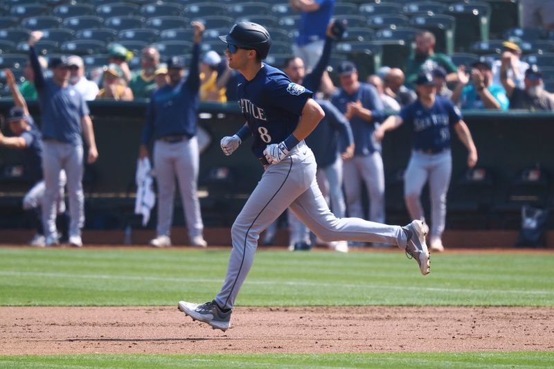 Sep 20, 2023; Oakland, California, USA; Seattle Mariners left fielder Dominic Canzone (8) rounds the bases on a two-run home run against the Oakland Athletics during the second inning at Oakland-Alameda County Coliseum. Mandatory Credit: Kelley L Cox-USA TODAY Sports